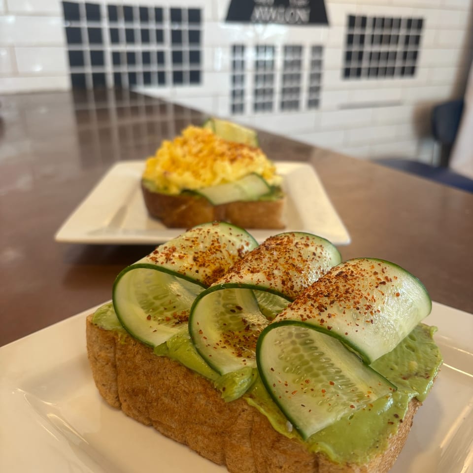 Avocado toast with cucumber ribbons at Avalon Cafe and Bakery.